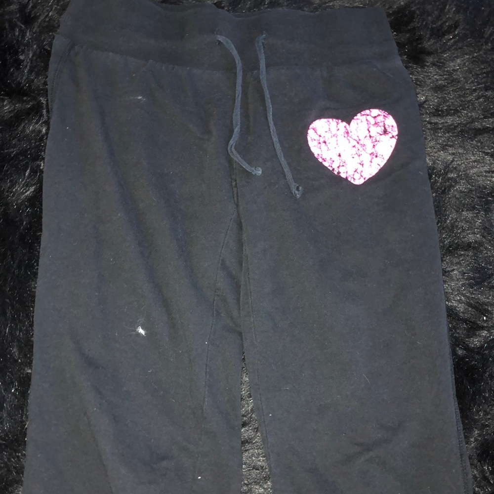 Black sweatpants with pink heart